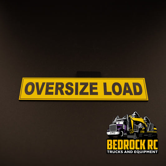 Bedrock Built Oversize Load Sign for 1/14 scale RC trucks – laser-etched hard plastic sign, 152mm x 32mm, bolt or glue mount, built in-house at Bedrock RC.